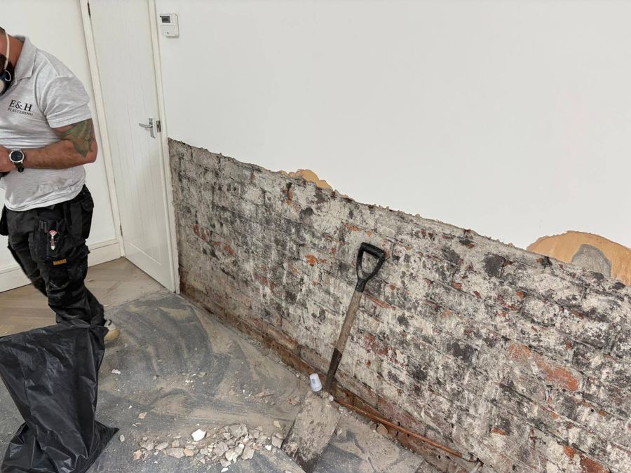 Step 1: damaged plaster stripped back to expose the affected brickwork