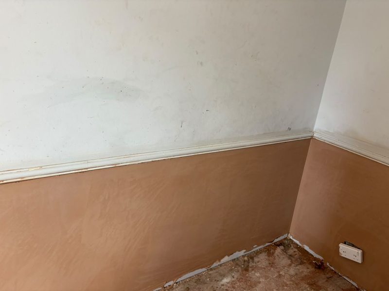 A room corner replastered to a smooth finish after damp treatment